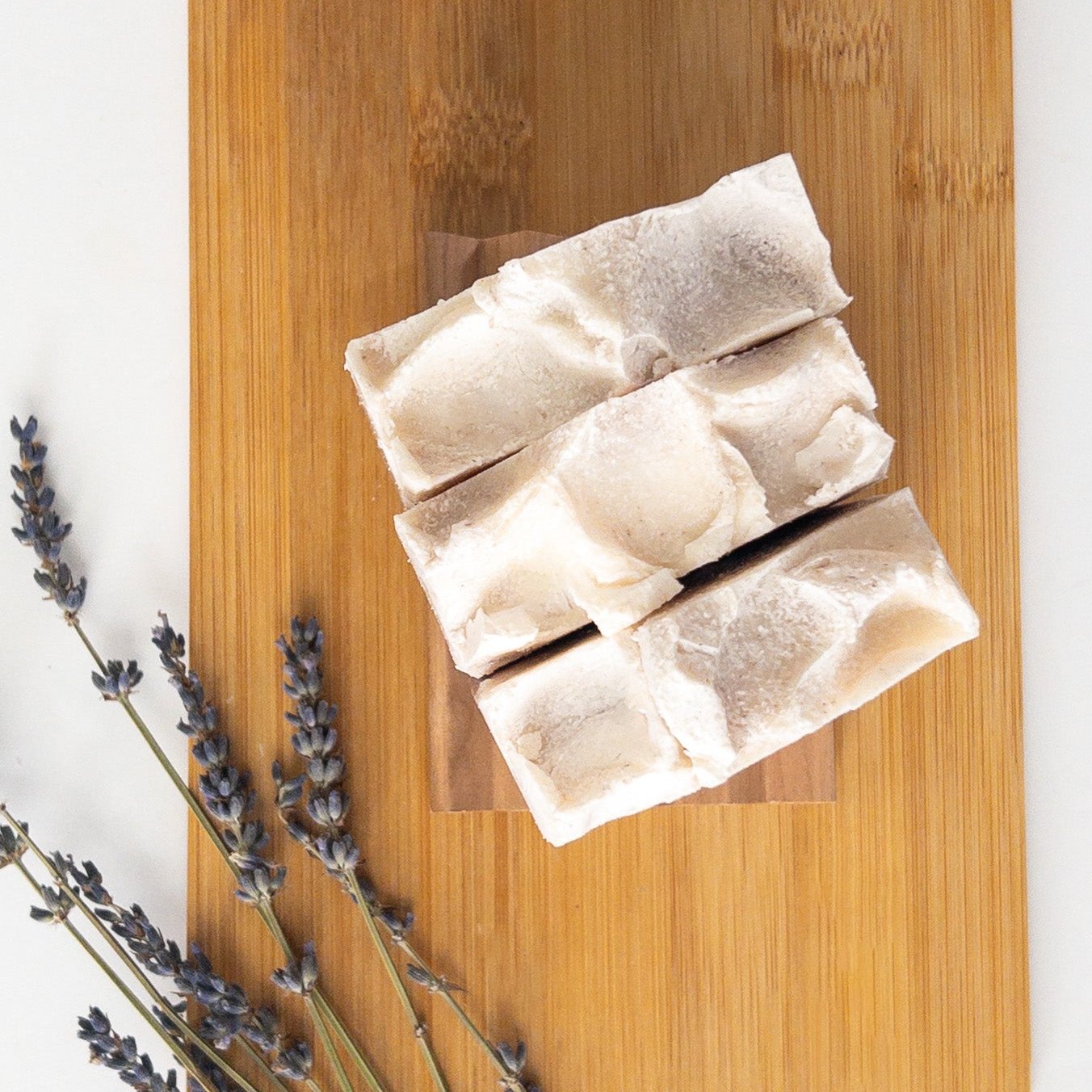 Three Amethyst Salt Soap Bars on a wooden surface