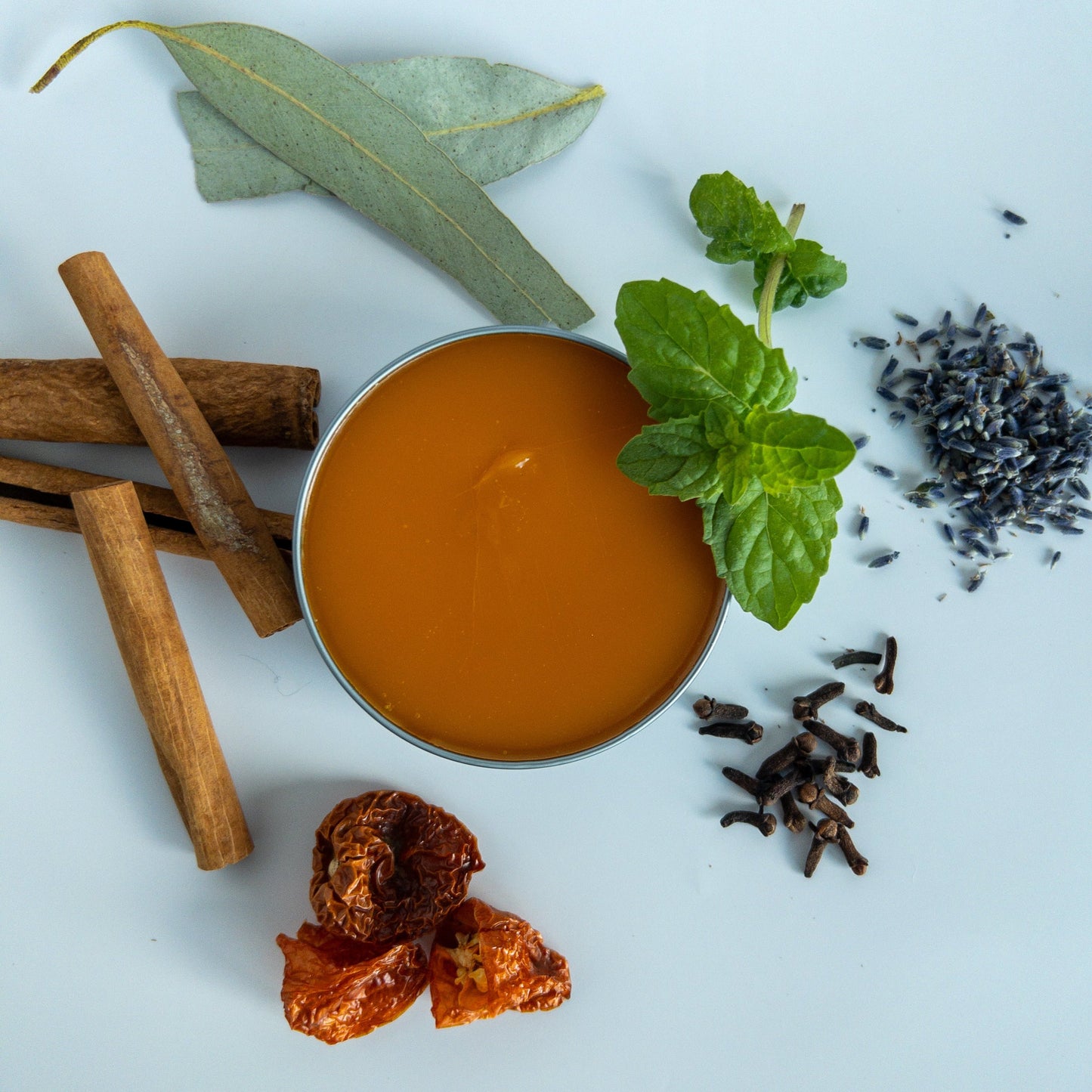 Ingredients for Trades of Brit Comforting Warming Muscle Rub: cinnamon, clove, lavender, eucalyptus, peppermint, beeswax, infused oil