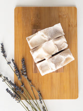 Load image into Gallery viewer, Three Amethyst Salt Soap Bars on a wooden surface

