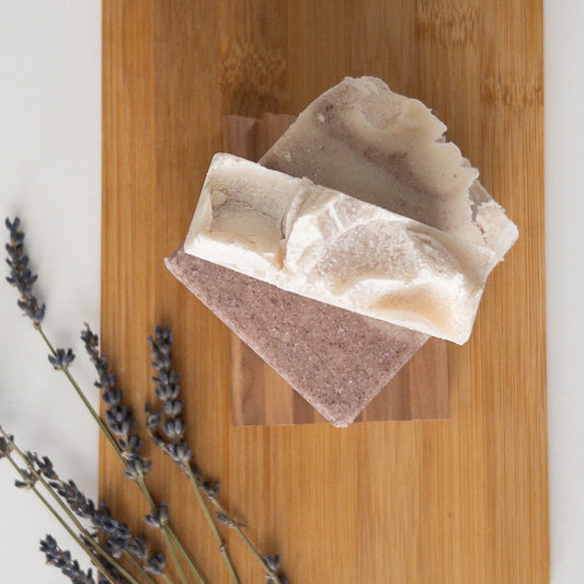 Trades of Brit Amethyst Salt Soap Bar on a wooden surface